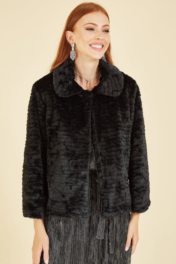 Yumi Black Faux Fur short jacket with hidden hook fastening and plush texture