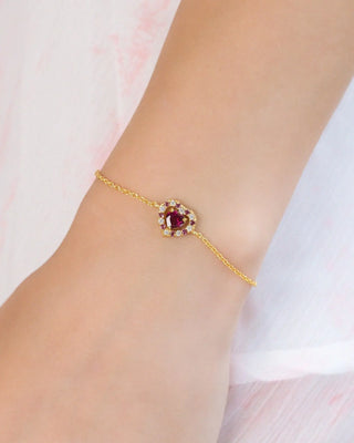 Red heart rhodolite garnet bracelet in 18k gold vermeil with pink rhodolites and simulated diamonds on wrist