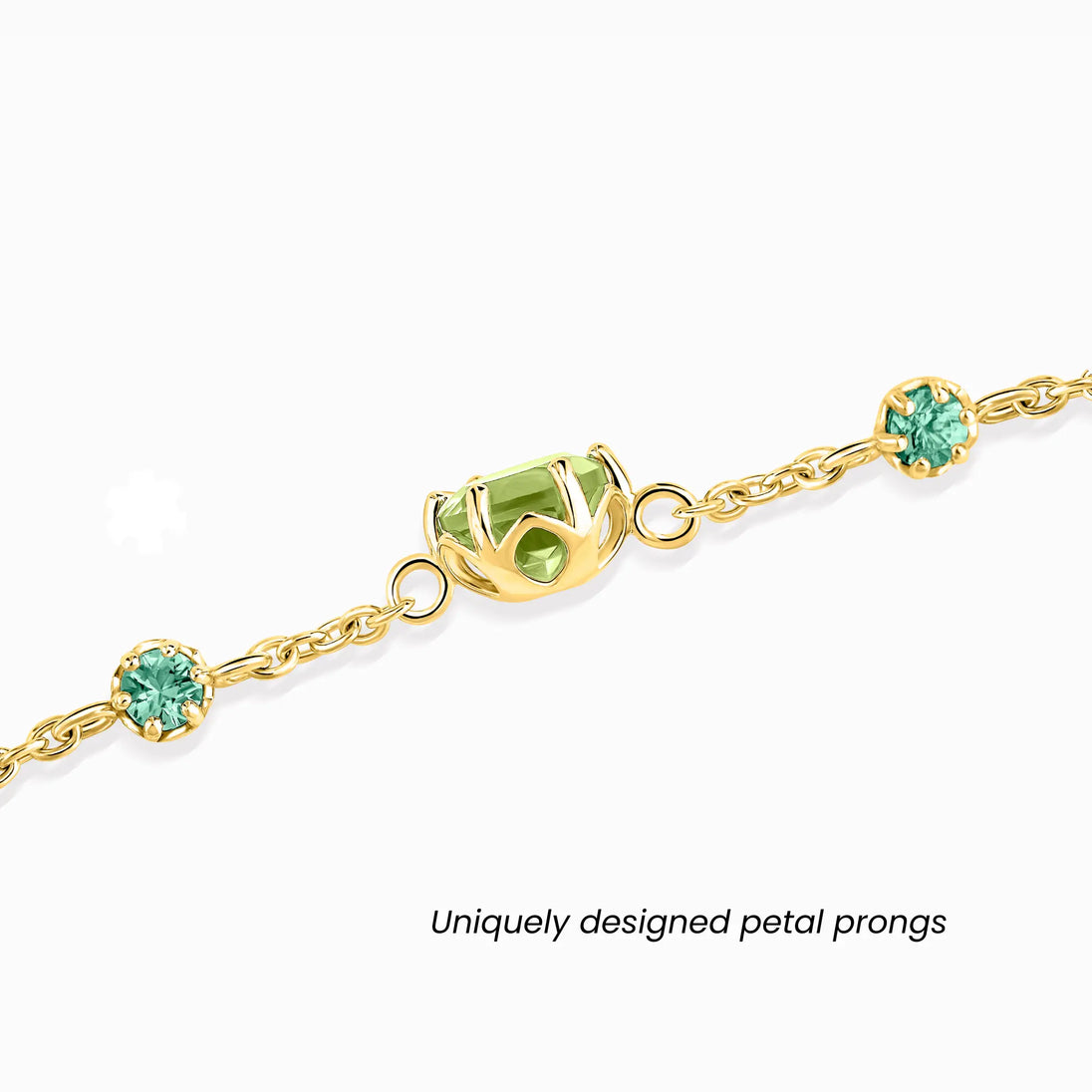 Emerald and Peridot jewellery set featuring handcrafted 18k gold vermeil bracelet and earrings with round-cut green gemstones