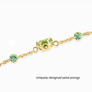 Emerald and Peridot jewellery set featuring handcrafted 18k gold vermeil bracelet and earrings with round-cut green gemstones