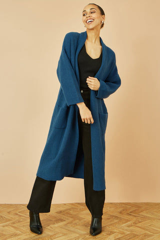 Yumi teal knitted maxi cardigan with pockets and ribbed detail worn with black outfit