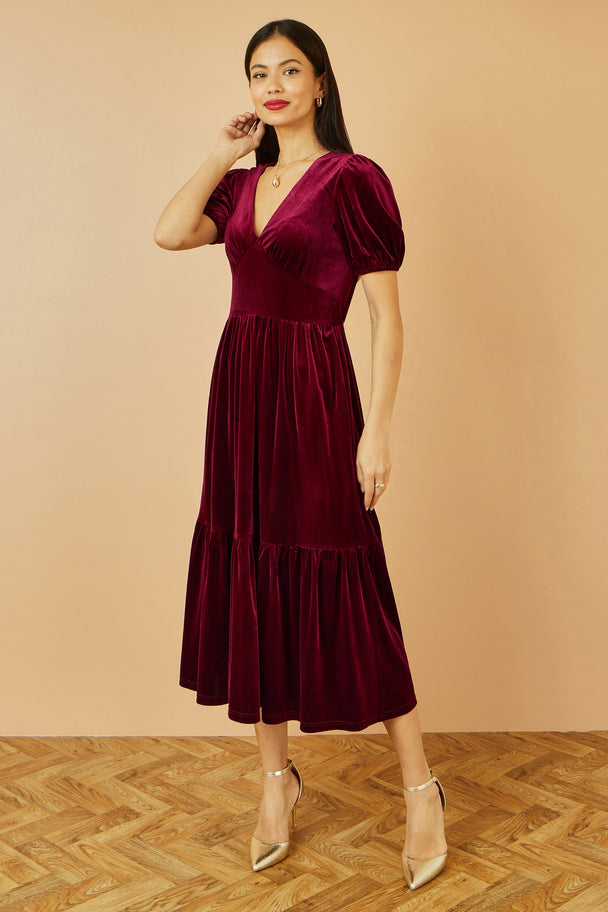 Yumi Burgundy Velvet Midi Dress with V-neck, tiered skirt, and pockets in rich burgundy velvet