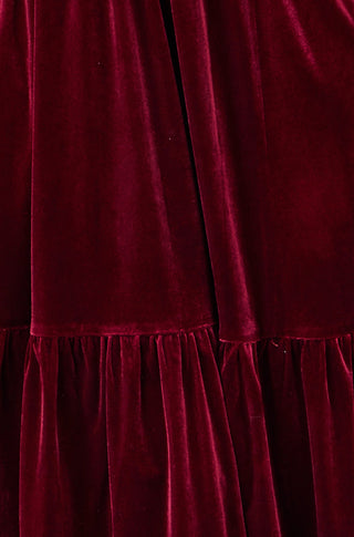 Yumi Burgundy Velvet Midi Dress with tiered skirt and pockets in rich burgundy color