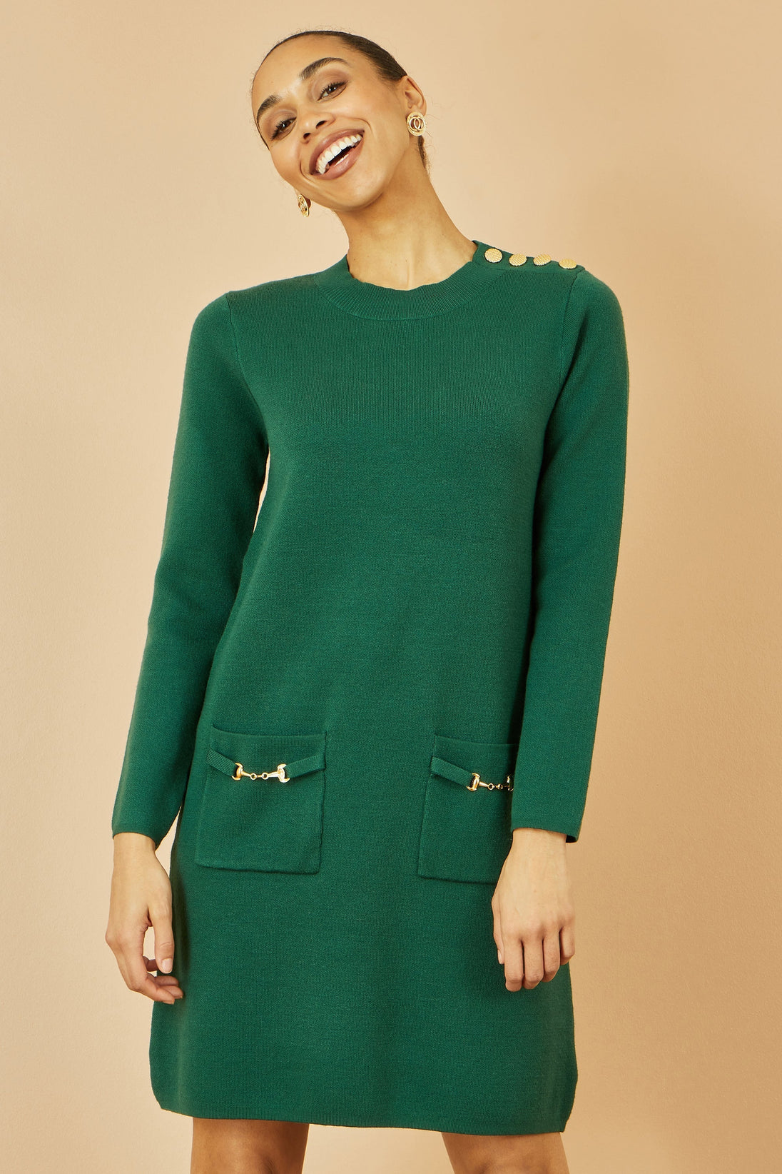 Yumi green knitted tunic dress with gold buttons on shoulder and pockets, long sleeves, relaxed fit