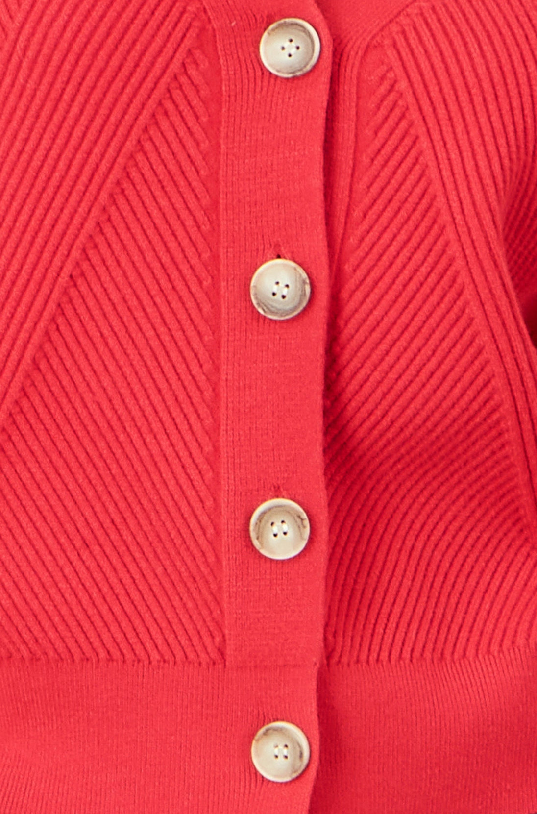 Close-up of Yumi red relaxed fit cardigan with button-up design and stitch detail