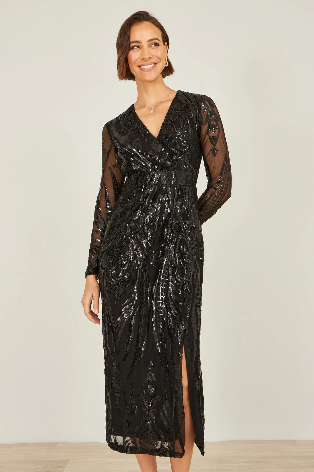 Yumi black sequin midi dress with long sleeves and split hemline