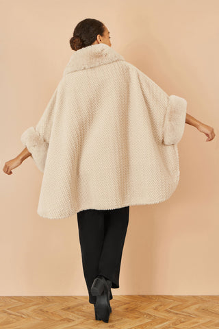 Yumi beige textured fur lined cape with oversized faux fur collar and buckle fastening