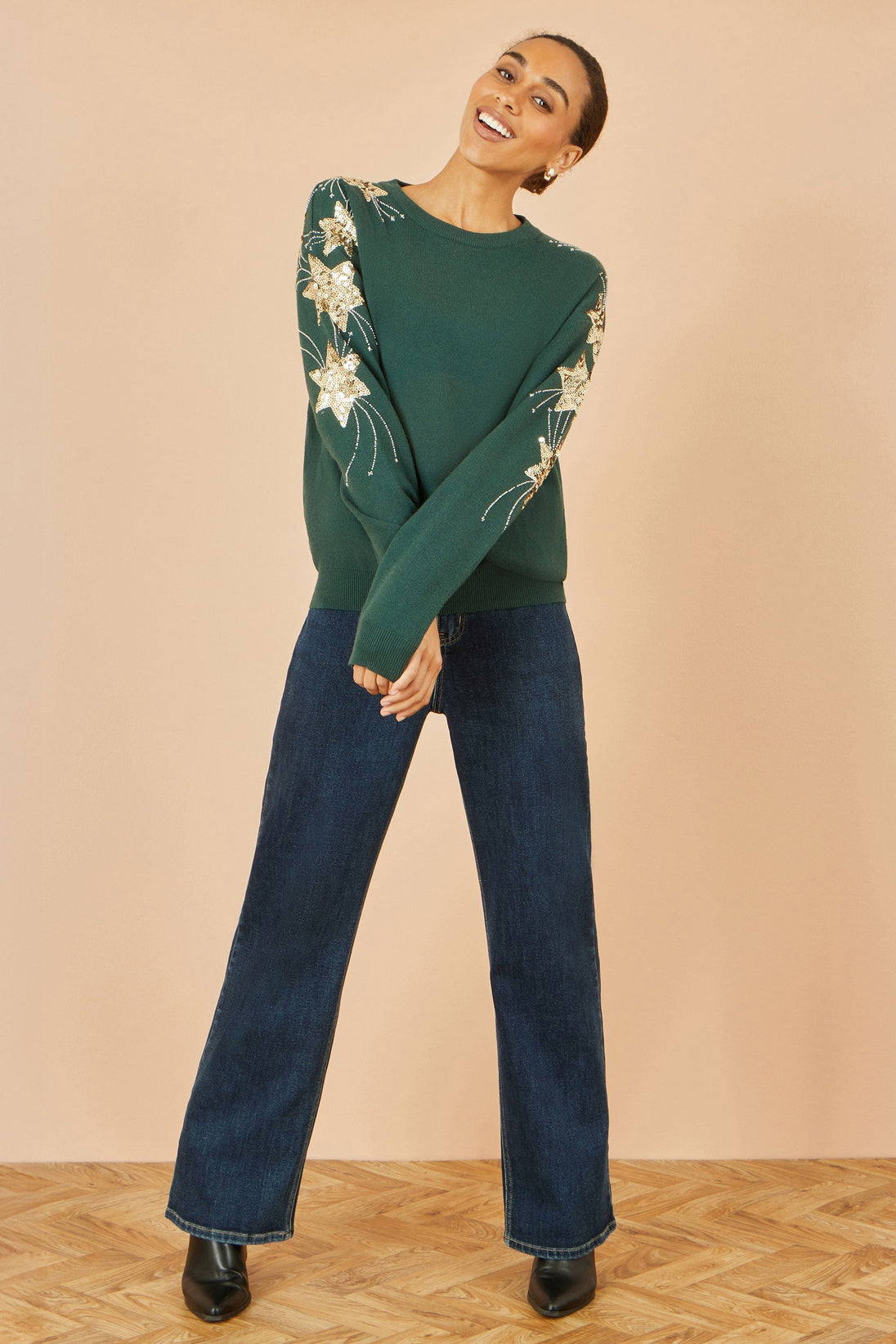 Yumi green relaxed fit jumper with sequin star sleeves, soft knit festive sweater for Christmas parties