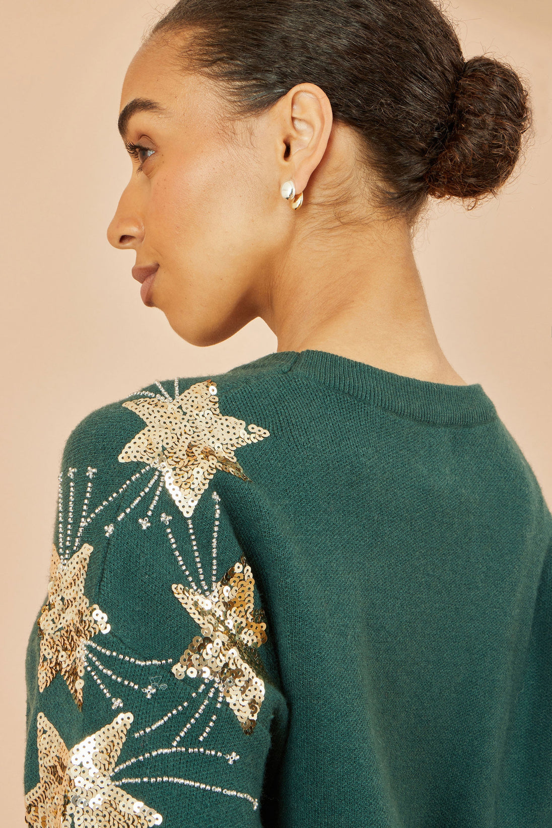 Yumi green relaxed fit jumper with sequin star sleeves and soft knit fabric