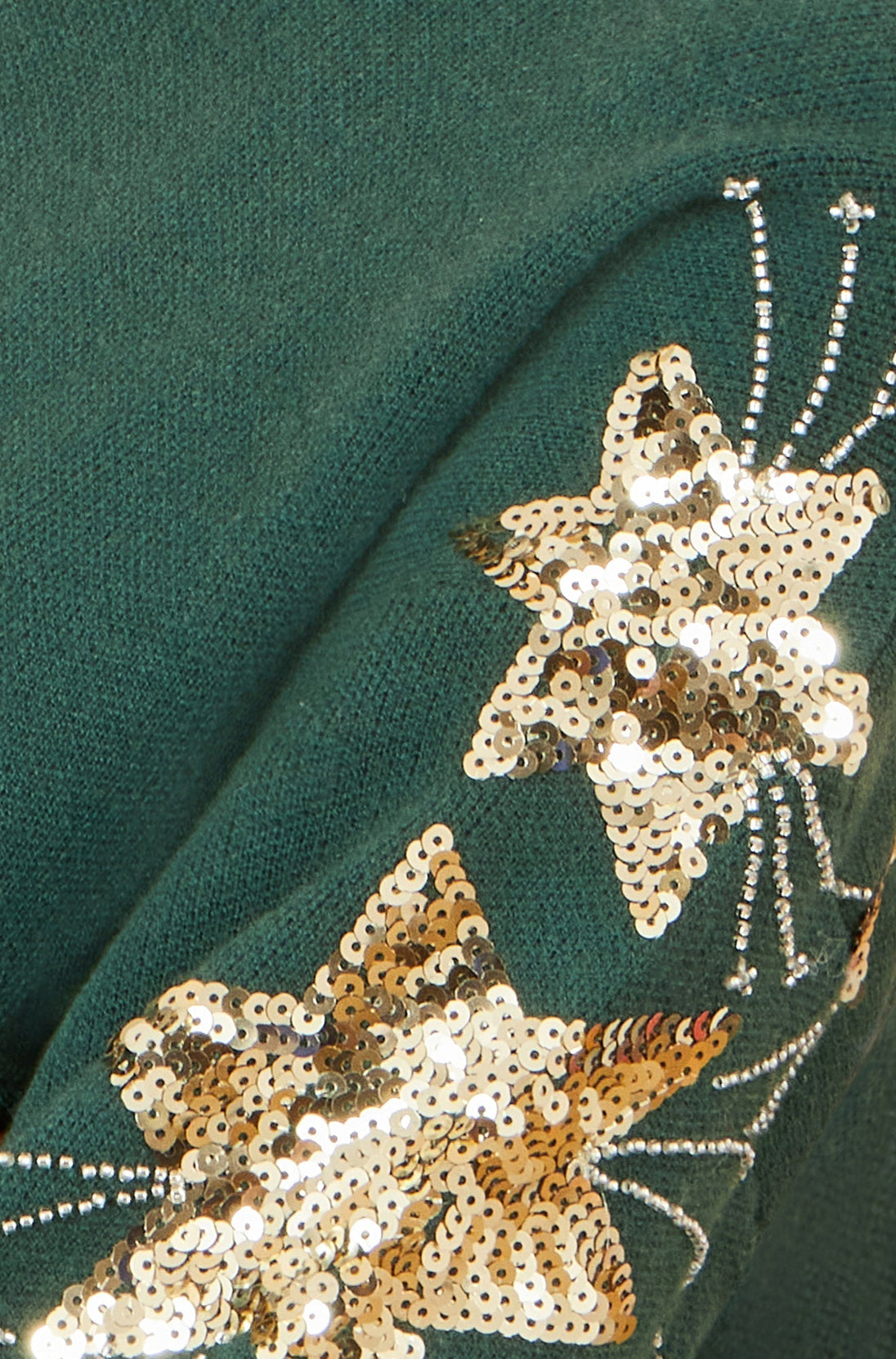 Yumi green relaxed fit jumper with gold sequin star sleeve detail