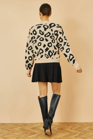 Yumi Beige Animal Print tie front intarsia knit cardigan worn with black skirt and boots