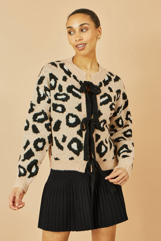Yumi beige animal print intarsia tie front cardigan with black bows and oversized pattern