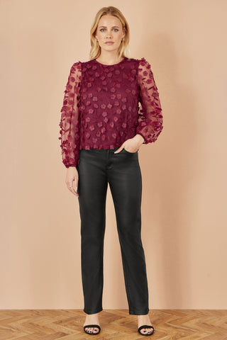 Yumi Burgundy Sheer Sleeve top with floral applique and black trousers