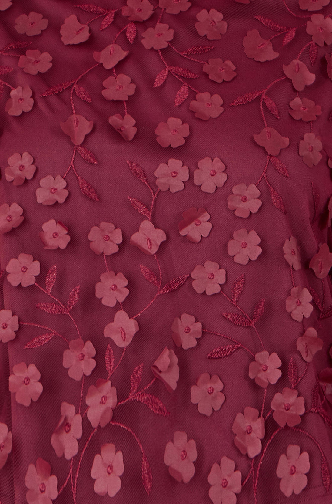Close-up of Yumi Burgundy Sheer Sleeve flower applique top with floral embroidery on sheer fabric