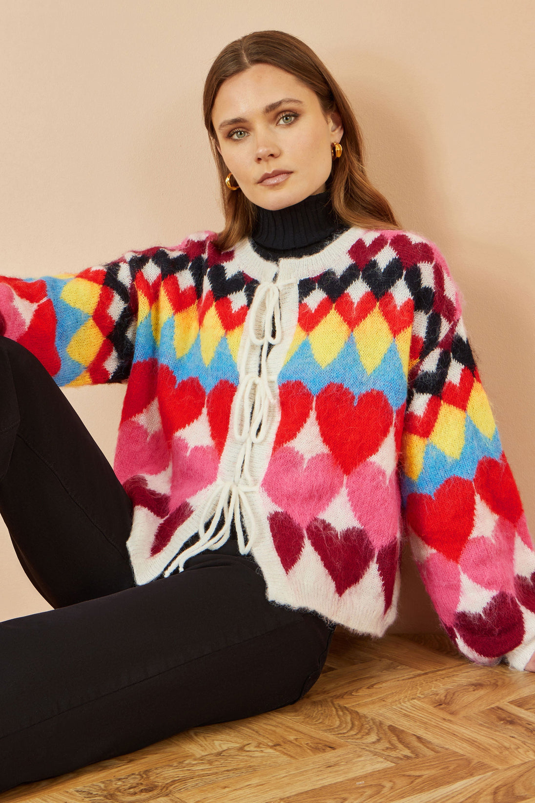 Yumi Multicolour Tie Front Heart Intarsia Cardigan with vibrant heart pattern and soft knit fabric