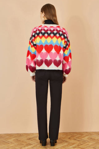 Yumi Multicolour Tie Front Heart Intarsia Cardigan with vibrant heart pattern and tie front fastening on model back view