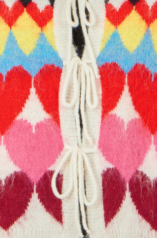 Close-up of Yumi Multicolour Tie Front Heart Intarsia Cardigan showing vibrant heart pattern and tie front detail