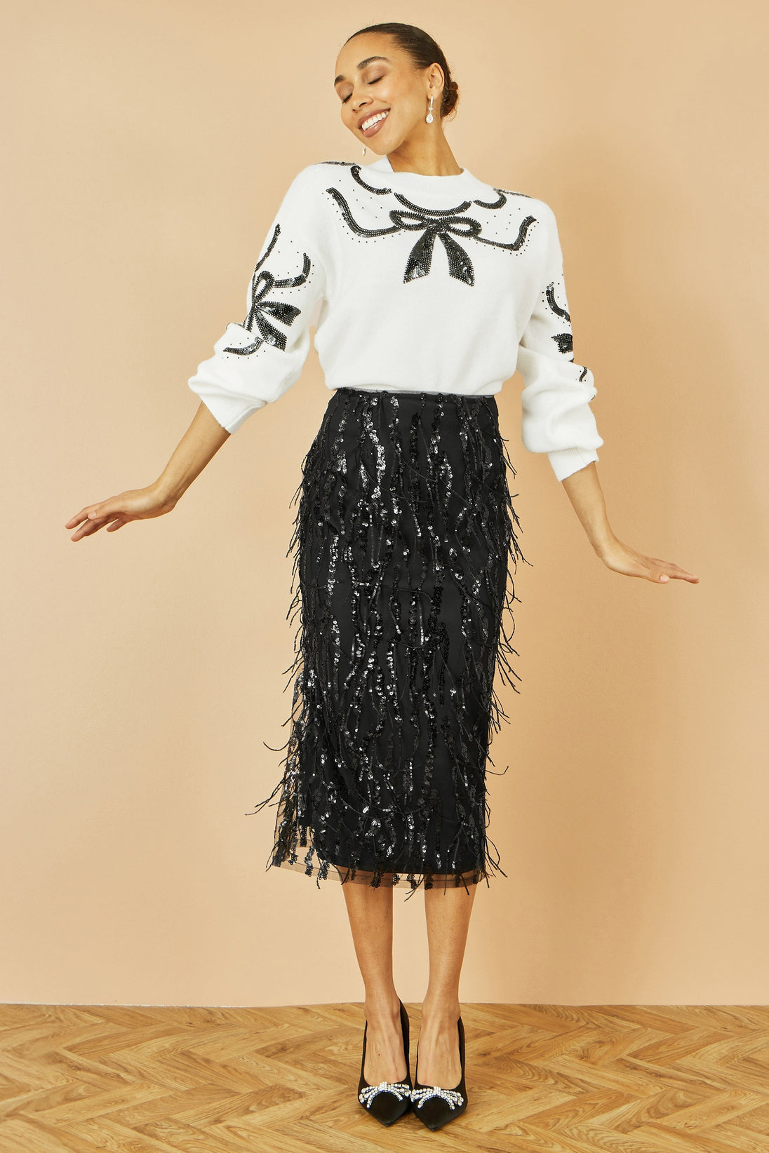 Yumi Black Hanging Sequin fitted midi skirt with glittering hanging sequins and elegant silhouette
