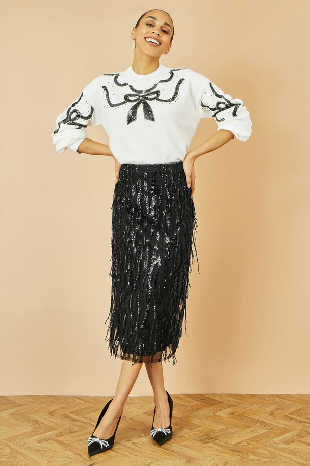 Yumi Black Hanging Sequin fitted midi skirt with shimmering hanging sequins and flattering silhouette.