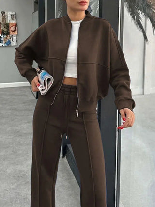 Woman wearing brown baseball collar zip up outerwear and drawstring pants set