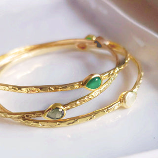 Simi Three Stone Stacking Bangle in 22k gold with three teardrop rainbow moonstones, handcrafted on recycled brass.