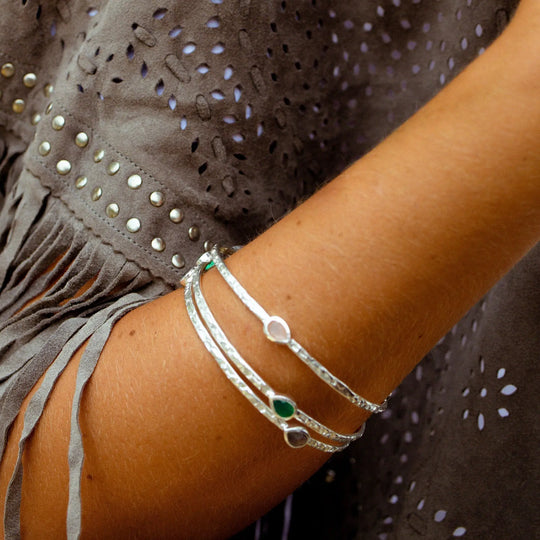 Simi Three Stone Stacking Bangle in sterling silver with aqua Pariba Onyx gemstones on wrist