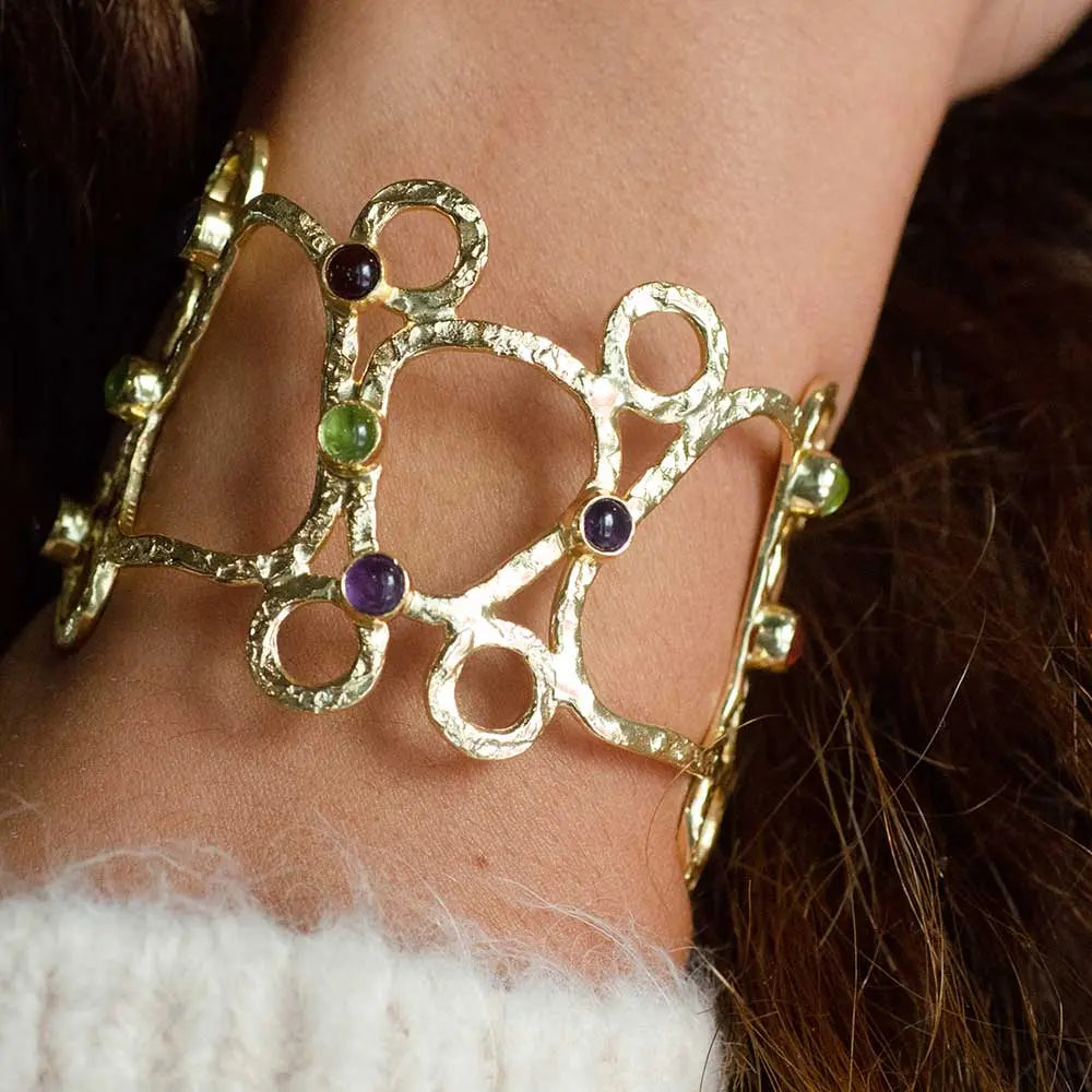 Thalia Sculptural Cuff handcrafted gold brass bracelet with rose quartz, moonstone, labradorite, and pariba onyx stones on wrist