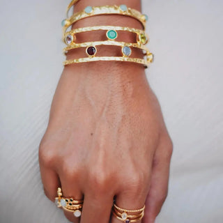 Venus Gemstone Bangle set with Rose Quartz, Amethyst, Iolite, and Pariba Onyx in 22k gold on brass