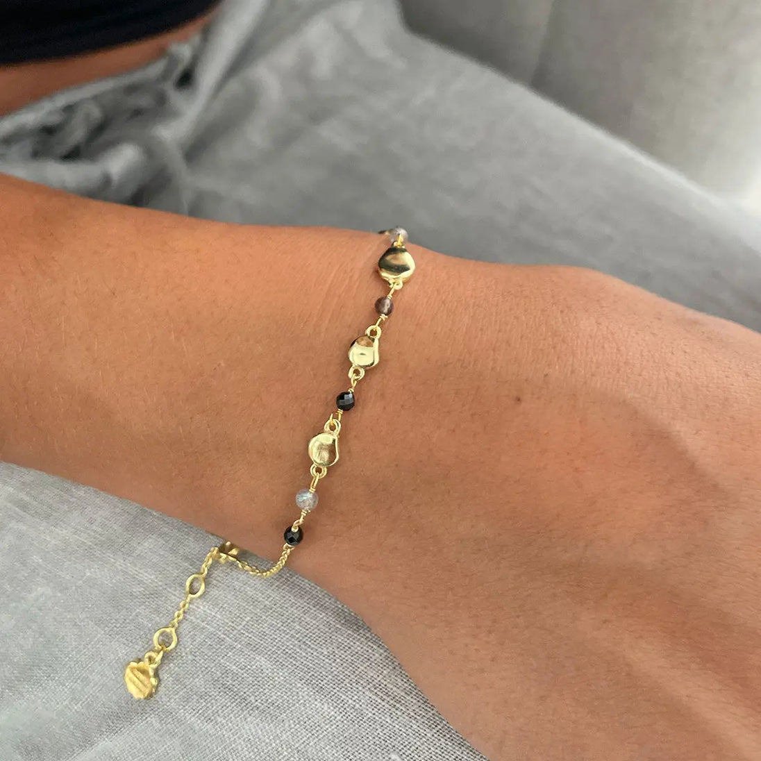 Sofia Nugget Bracelet with black onyx, smoky quartz, labradorite and 22k gold beads on wrist