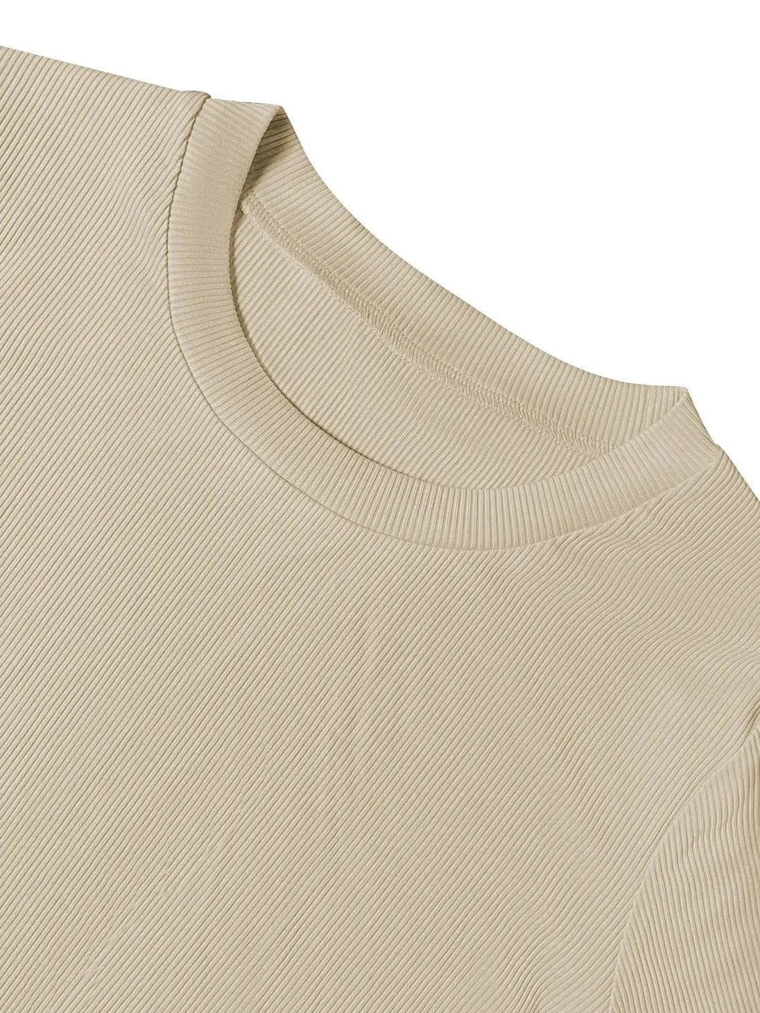 Close-up of beige round neck long sleeve top made of ribbed fabric