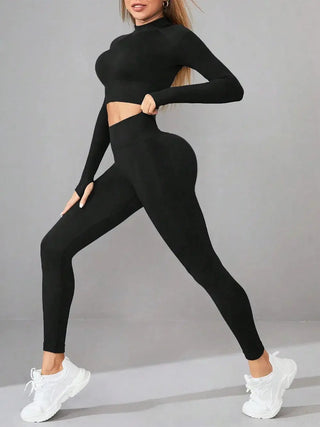Black mock neck long sleeve top and leggings active set for women with stretchy, form-fitting design.