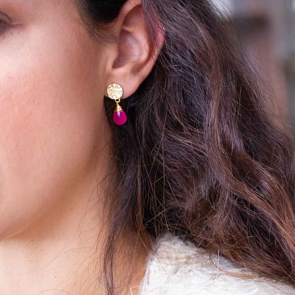 Classic Athena Drop Earrings in 22K gold with vibrant fuchsia onyx gemstones, handcrafted and worn as a stylish drop earring.