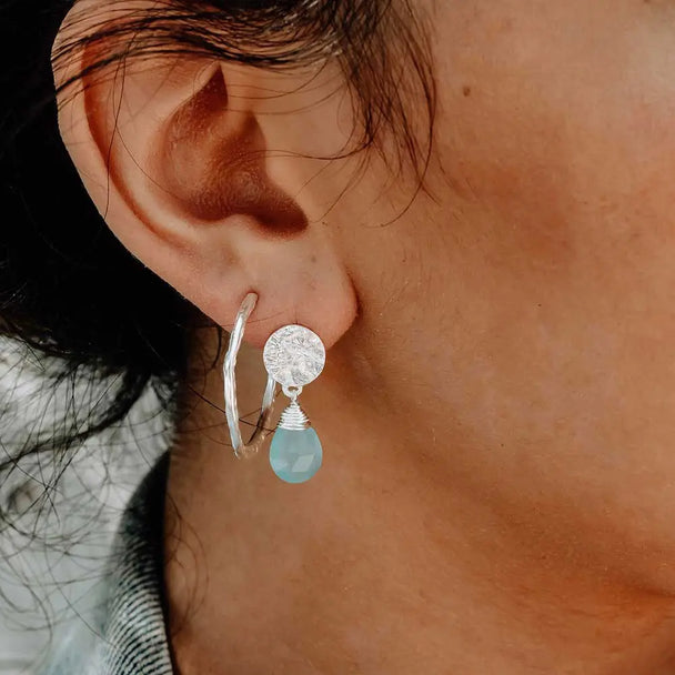 Classic Athena Drop Earrings featuring sterling silver coin stud and aqua Pariba Onyx briolette gemstone worn on ear