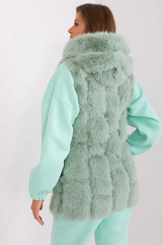 Women’s hooded faux fur vest in soft mint green polyester with practical pockets and zipper closure
