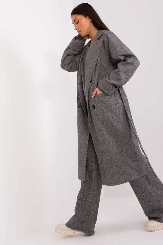 Classic transitional coat in gray, over-the-knee length, button closure, with tie belt and patch pockets.