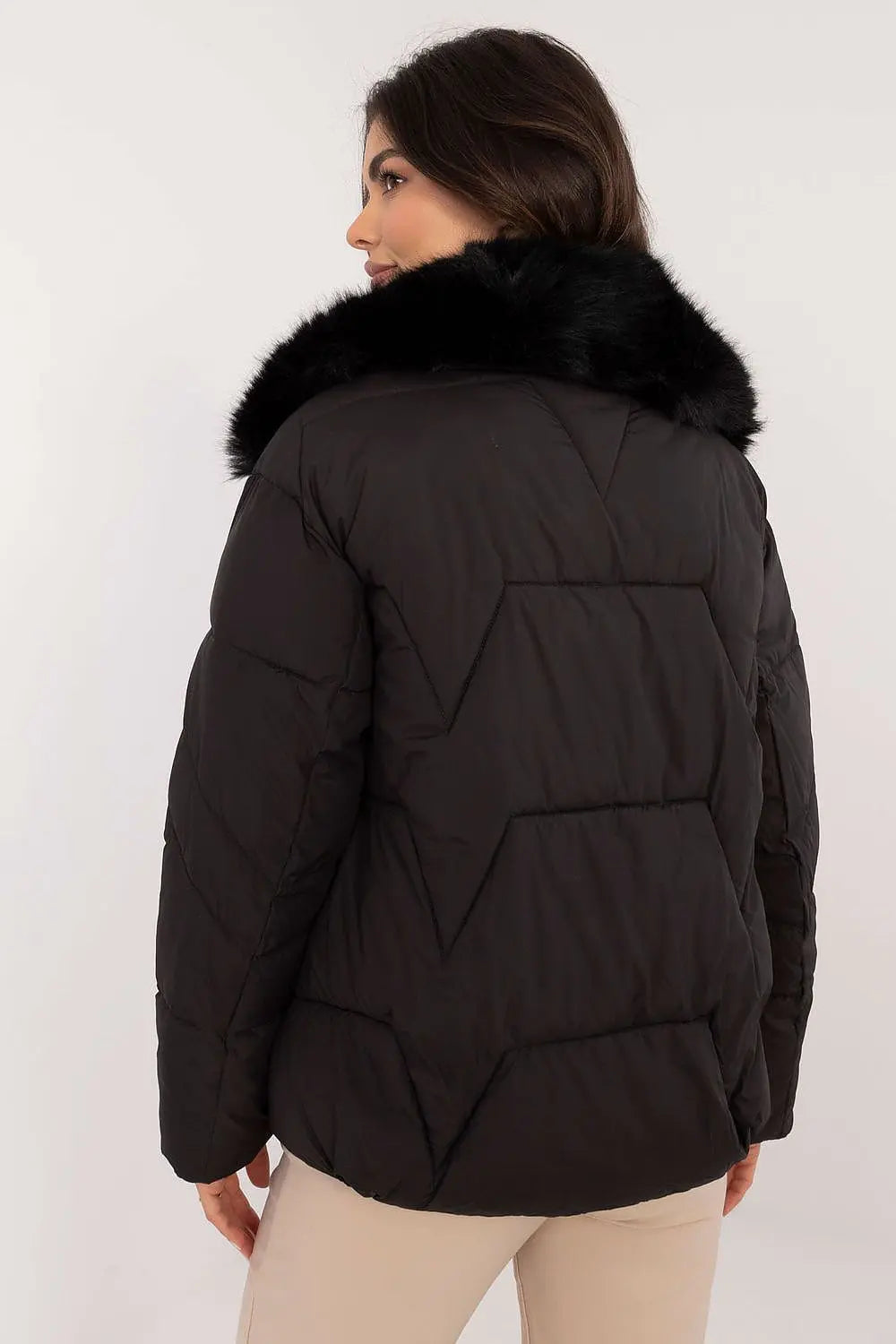Elegant black women’s quilted winter jacket with fur collar and zipper closure shown from back