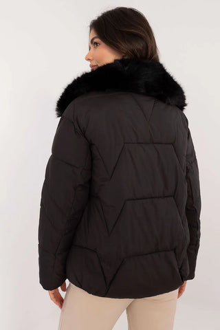 Elegant black women’s quilted winter jacket with fur collar and zipper closure shown from back