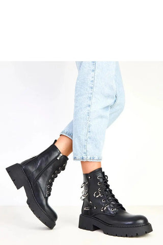 Black women's decorative buckles boots with synthetic leather, metal accents, and chunky heel