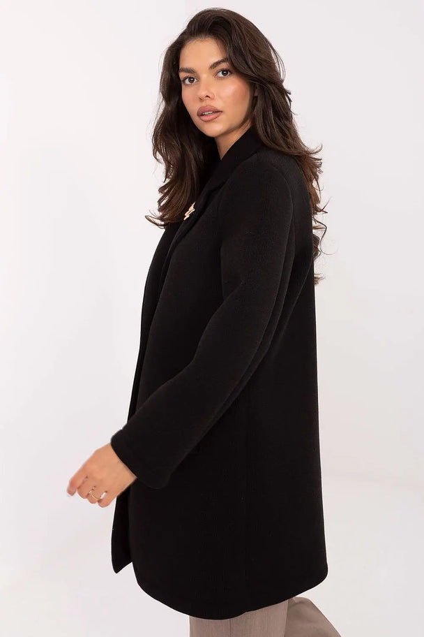 Elegant black women’s transitional coat with lapels and brooch, lightweight and stylish for autumn, winter, and spring.
