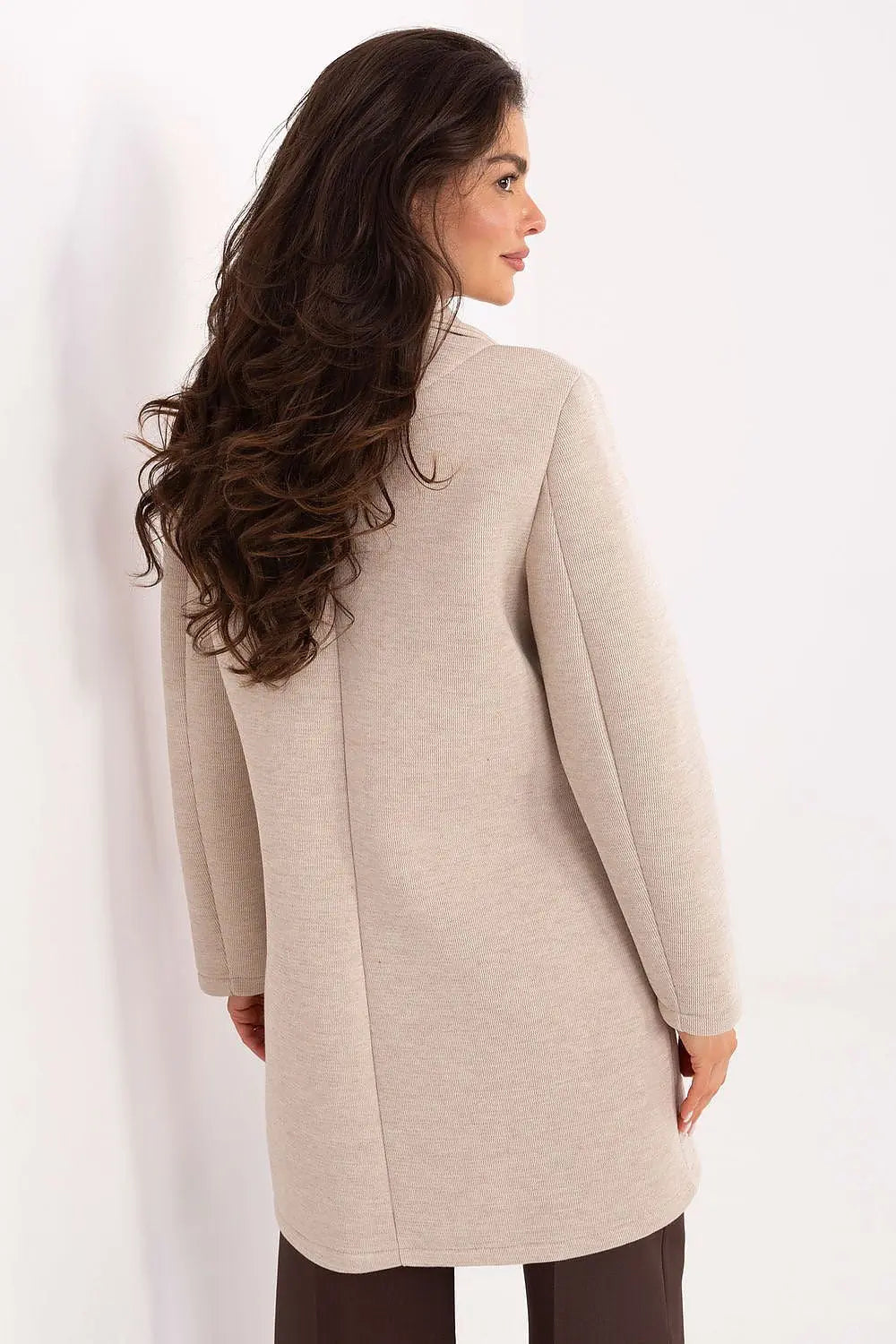 Back view of elegant women's transitional coat in beige with long sleeves and smooth texture