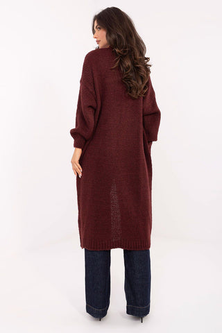 Long women's cardigan in maroon knit, knee-length with long sleeves and slip pockets, styled casual and comfortable.