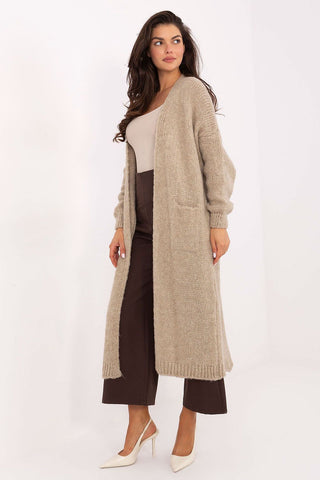 Long women's cardigan in beige with long sleeves and knee-length design, featuring slip pockets and soft textured fabric for casual and work wear