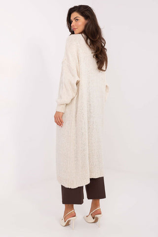 Long women's cardigan in cream color with long sleeves and knee-length design, made of soft polyacrylic blend, casual and comfortable style.