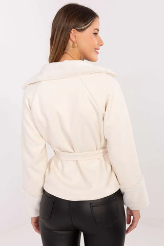 Elegant short women's coat with fur trim and waist belt, cream color, back view.