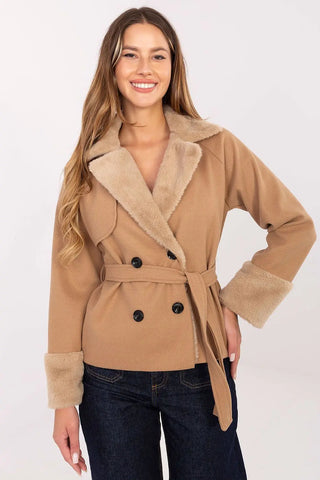 Elegant short women’s coat with fur trim and belt in camel color worn by smiling woman