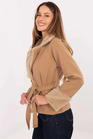 Elegant short women’s coat with fur trim and belt in camel color