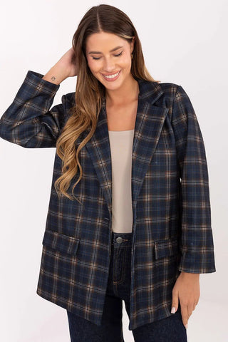 Woman wearing a stylish blue and brown checked blazer with long sleeves and shoulder pads