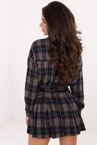 Woman wearing brown plaid short skirt with godets and belt, back view