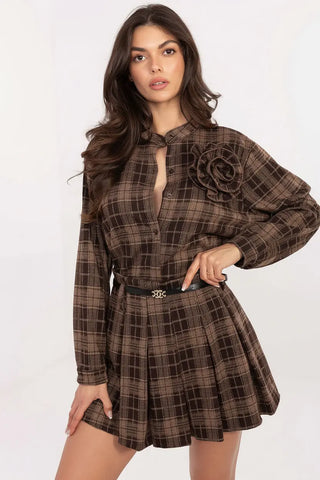 Woman wearing brown plaid short skirt with godets and belt, styled for casual or elegant looks