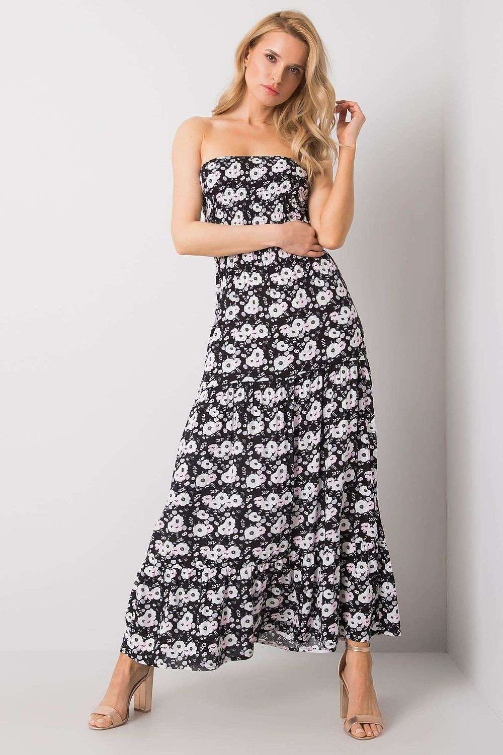 Long summer dress with floral pattern, strapless design, and ruffled bottom.